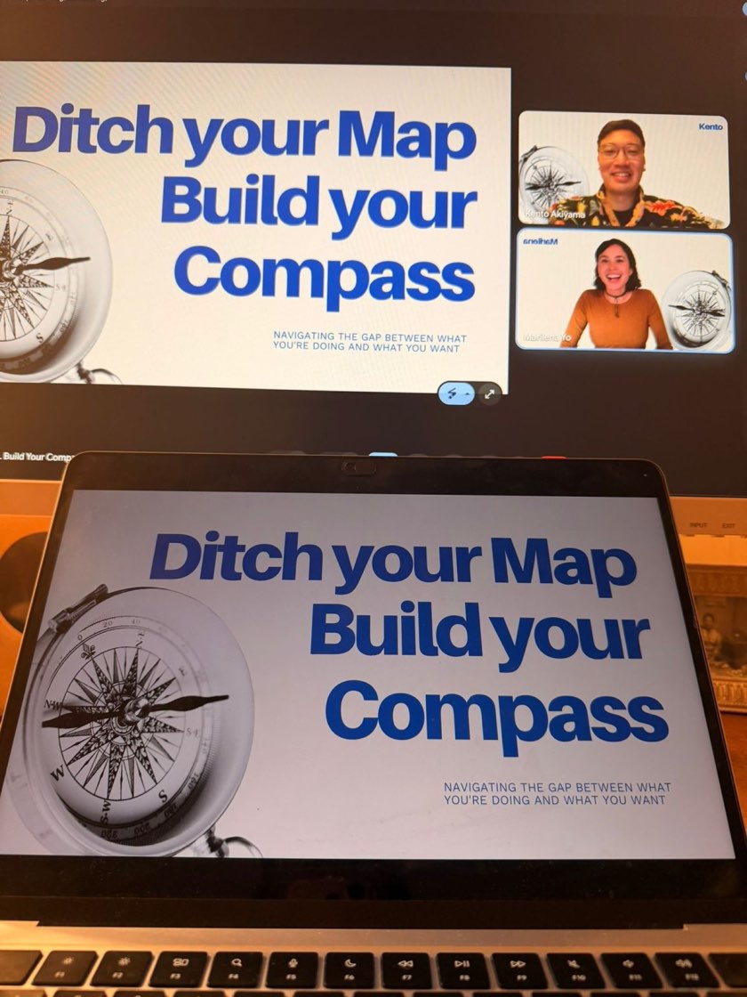 A laptop and a second screen during an online Less Lost session, showing a slide that reads Ditch your Map, Build your Compass, with two hosts on video next to it.